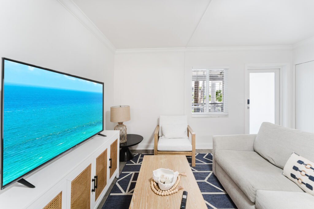 Modern living area in business and corporate stays in Coventry with comfortable seating and smart TV