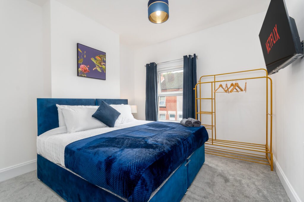 Modern bedroom with double bed in a fully furnished Coventry rental property